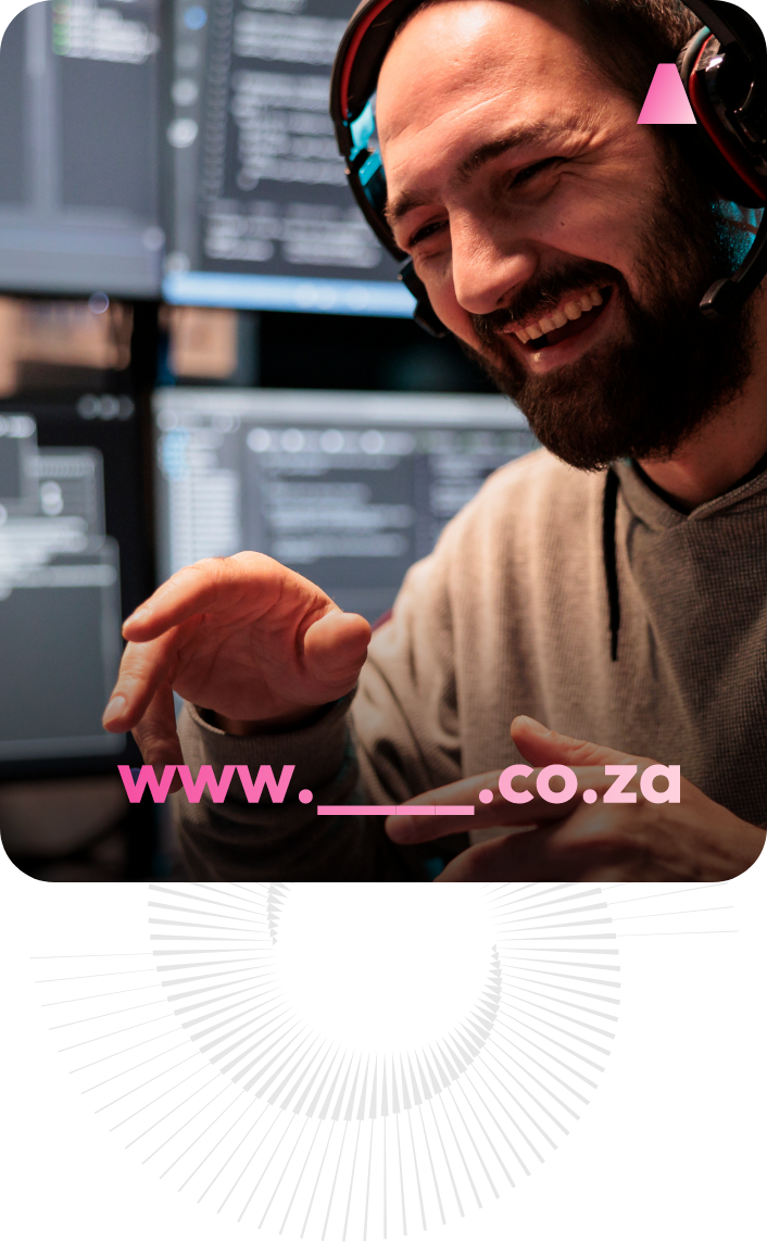 Man laughing with headphones on in front of a monitor